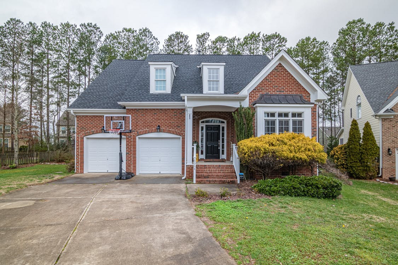 family house with driveaway and landscaping