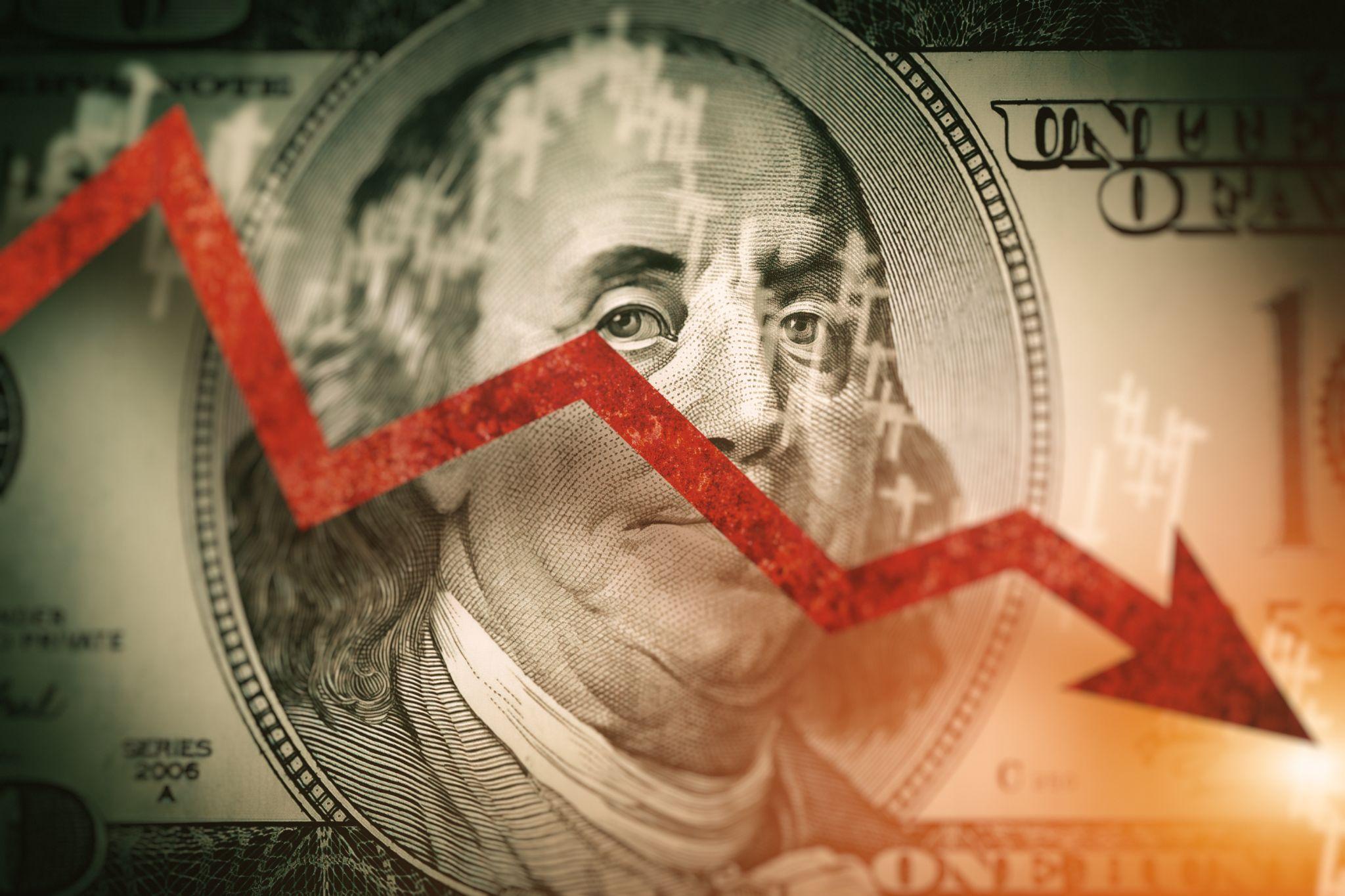 Representation of a recession or economic downturn: Money with a downward arrow
