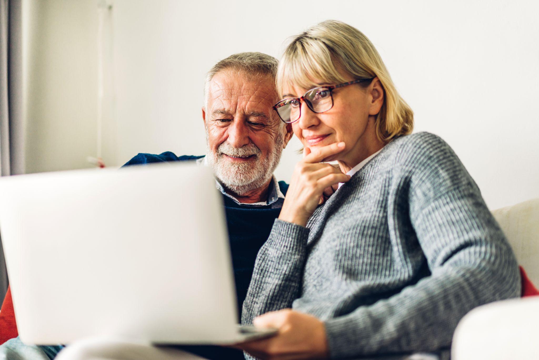 Couple deciding if they should sell their house this year by reviewing their finances