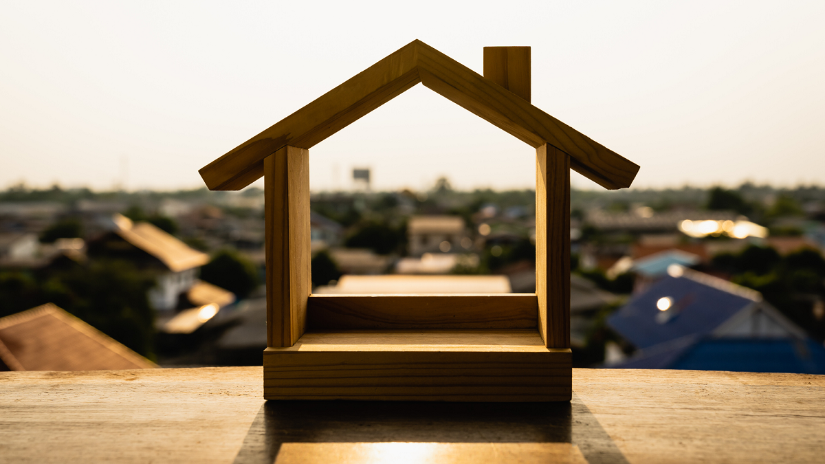 House model on wood table. Real estate agent offer house, property insurance and security