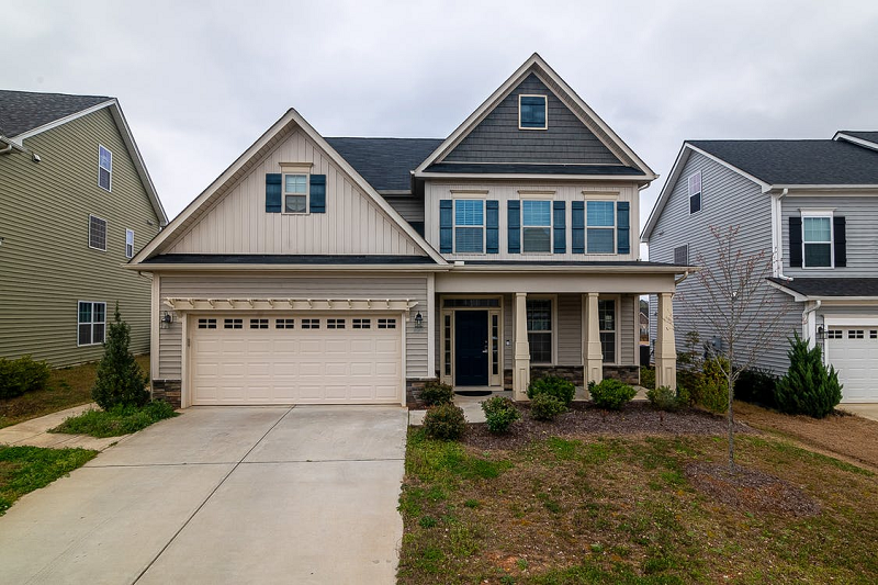 Family house with driveway and landscaping