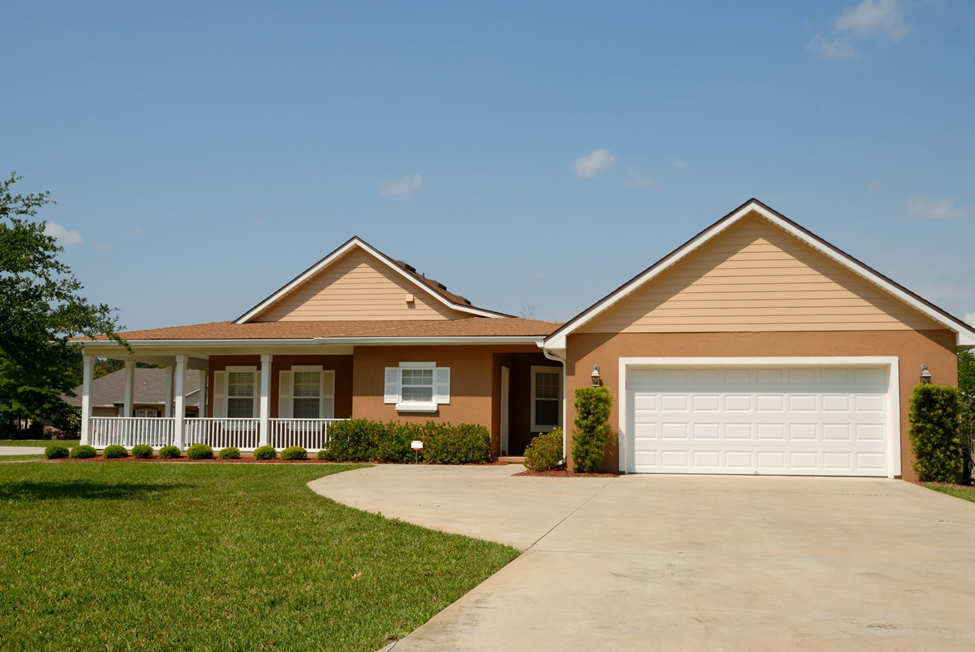 suburban home with front porch and driveway