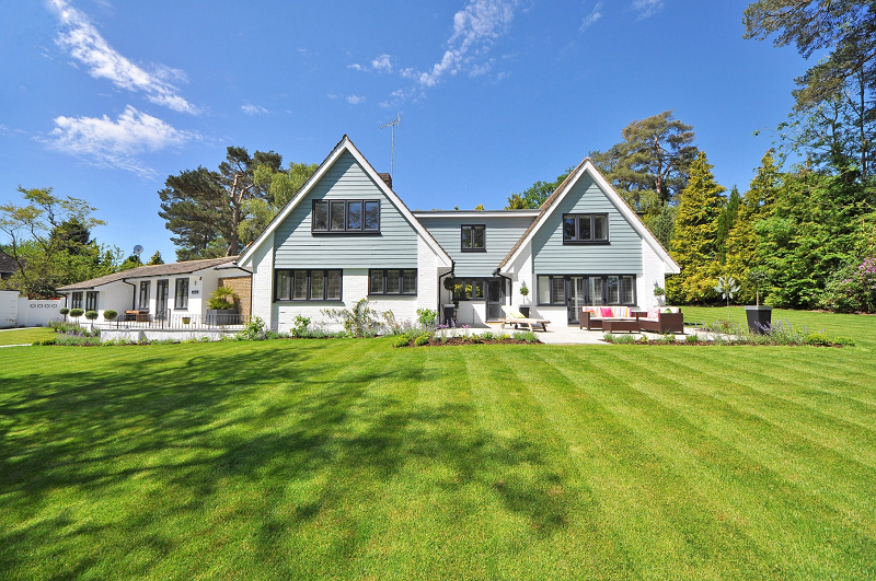 Luxury house with nicely landscaped and trimmed front yard