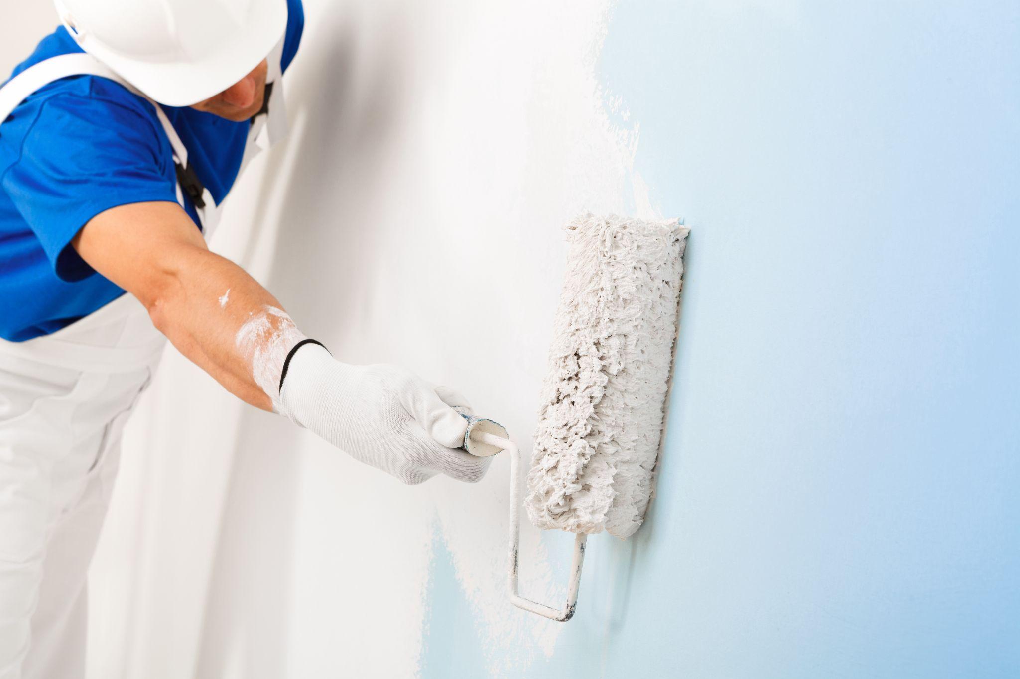 Man painting his house