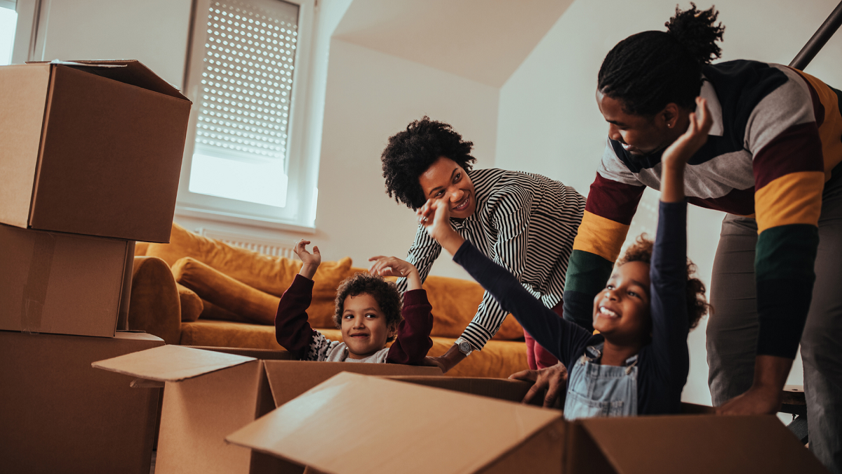 Parents and their children moving into a new house