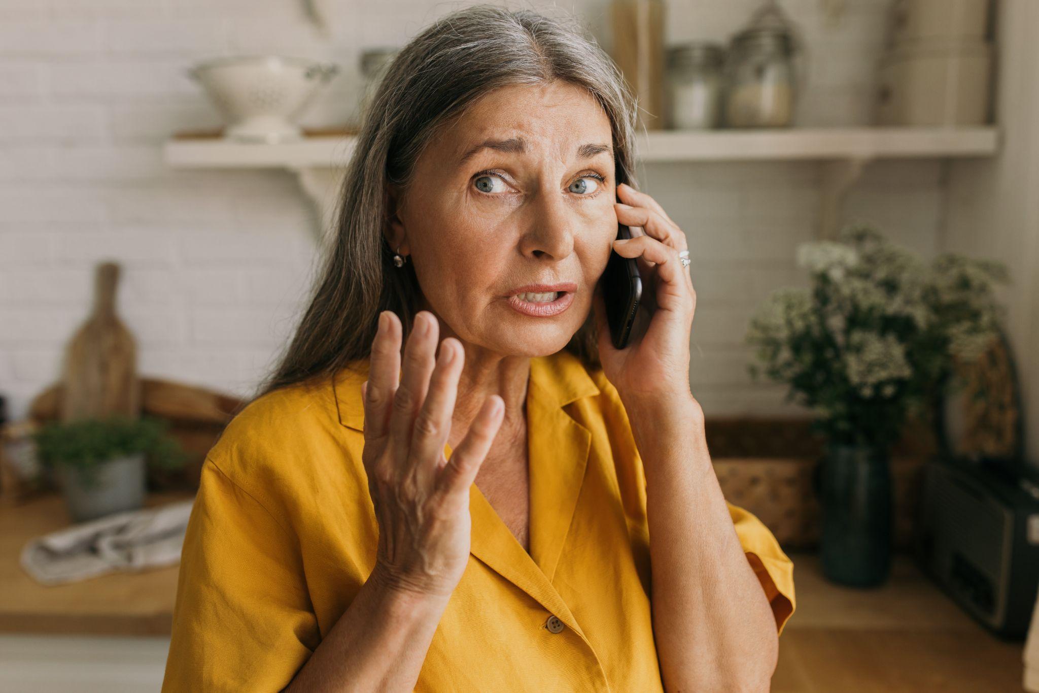 Woman calling a professional to help because she can't pay her mortgage